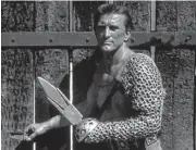  ?? Universal Internatio­nal Pictures ?? Kirk Douglas stars as an enslaved gladiator who starts a slave revolt in “Spartacus.”