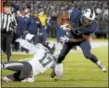  ?? THE ASSOCIATED PRESS FILE PHOTO ?? UConn running back Arkeel Newsome breaks a tackle.