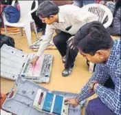  ?? PTI ?? Election Commission officials check the electronic voting machines (EVMs) in Ahmedabad on Wednesday.