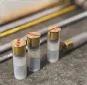  ??  ?? Left: Proof Master Richard MabbittTop: the punches used to apply proof marks Above: proof cartridges loaded at the British Proof Laboratory. Right: a gun being remotely test fired