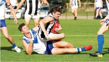  ??  ?? Tom Muir pulls down Poowong’s Cody Loughridge in a strong tackle in the EDFL game held at Neerim South on Saturday.