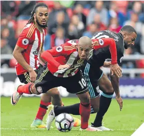  ??  ?? Wahbi Khazri (centre) gets away from West Brom’s Matt Phillips.