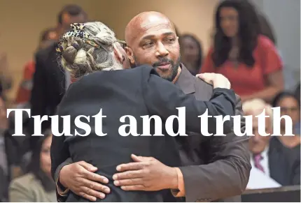  ?? POOL PHOTO BY JAMES CARBONE ?? Keith Bush’s attorney, Adele Bernhard, hugs him May 22 after murder charges against him were vacated. Bush spent 33 years in prison after being convicted in the murder of a high school classmate in 1975.