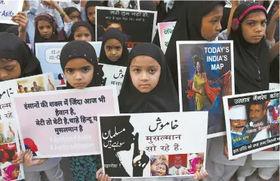  ??  ?? Young Indian students take part in a protest in support of rape victims in India in Ahmedabad yesterday, following high profile cases in Jammu and Kashmir state and Uttar Pradesh state. — AFP