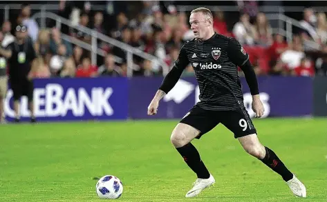  ??  ?? Wayne Rooney in possession for DC United against Vancouver Whitecaps during his Major League Soccer debut in JulyPATRIC­K MCDERMOTT/GETTY IMAGES