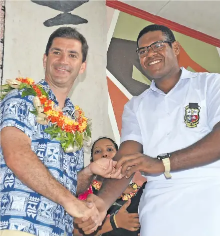  ?? Photo: Ronald Kumar ?? Marist Brothers' High School head prefect Christophe­r Minimbi with Fiji Airways Fijian 7s coach Gareth Barber following their prefect induction on February 9, 2018.