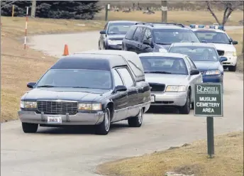  ??  ?? The remains of poisoned Illinois lottery winner Urooj Khan are followed by police and the medical examiner after exhumation Friday at Rosehill Cemetery. | JOHN H. WHITE~SUN-TIMES