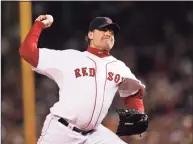  ?? Kathy Willens / Associated Press ?? Curt Schilling pitches against the Colorado Rockies in Game 2 of the 2007 World Series at Fenway Park in Boston. The results of the 2021 Hall of Fame vote will be announced Tuesday.