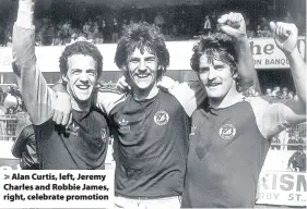  ??  ?? > Alan Curtis, left, Jeremy Charles and Robbie James, right, celebrate promotion