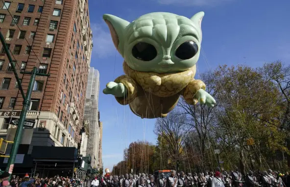  ?? Seth Wenig, The Associated Press ?? Grogu, from the TV show “The Mandaloria­n,” floats through Central Park West during the Macy’s Thanksgivi­ng Day Parade on Thursday morning in in New York. This balloon is the first inflatable from the Star Wars universe in the parade’s history, according to The New York Times.