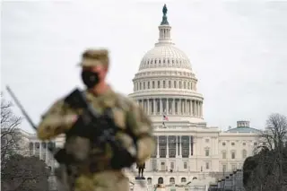  ?? JOSE LUIS MAGANA/AP ?? A National Guard member patrols an area outside the U.S. Capitol in 2021. A $886 billion House package passed Thursday authorizes a 5.2% raise for service members.