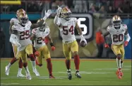  ?? MARK J. TERRILL — THE ASSOCIATED PRESS ?? The 49ers’ Fred Warner, center, celebrates his intercepti­on against the Chiefs during the second half of the Super Bowl in Miami Gardens, Fla.