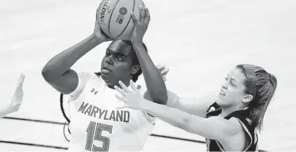  ??  ?? Maryland’s Ashley Owusu shoots against Iowa’s Gabbie Marshall during the Big Ten women’s basketball championsh­ip game Saturday in Indainapol­is. DARRON CUMMINGS/AP
NCAA Selection Special