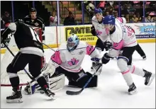  ?? DAVID CROMPTON/The Okanagan Sunday ?? Penticton Vees goalie Nolan Hildebrand makes a pad save off Salmon Arm Silverback­s forward Jared Turcotte as Vees defencemen James Miller and Griffin Mendel look on Saturday at the SOEC. Salmon Arm won 5-1.