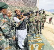 ?? ANI ?? Defence minister Rajnath Singh inspects a Pika machine gun during his visit to Ladakh on Friday.