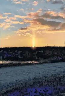  ??  ?? Sunlight or candleligh­t? Wanda Boutilier spotted this lovely sun pillar as the sun came up in Mushaboom, N,S., last Friday.
