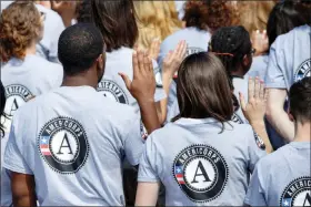  ?? J. SCOTT APPLEWHITE / ASSOCIATED PRESS FILE (2014) ?? Hundreds of Americorps volunteers are sworn in Sept. 12, 2014, at a ceremony on the South Lawn of the White House.