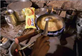  ?? PHOTO: REUTERS ?? A vendor prepares Maggi noodles at an eatery in New Delhi on Sunday. India’s government has filed for damages from Nestlé after a food scare involving Maggi noodles forced a recall.