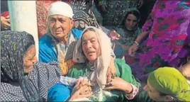  ?? WASEEM ANDRABI/HT ?? Relatives wait for the body of BSF soldier Ramzan Parray, who was killed by militants late on Wednesday night at his house in Hajin, Bandipora district, north of Srinagar.