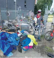  ?? JASON PAYNE ?? Litter, trash and discarded needles carpet the former homeless camp on Main Street in Vancouver. The campers moved to another location after a judge ordered the Main Street camp dismantled.