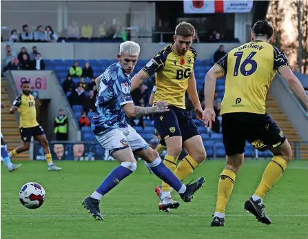  ?? Pictures: Gerard Austin ?? EYES ON THE BALL: Port Vale’s Sammy Robinson tussles for possession in the defeat at Oxford.