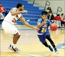  ?? Photo courtesy of JBU Sports Informatio­n ?? John Brown freshman guard Jaylon Rucker drives to the basket as MidAmerica Nazarene (Kan.) guard Gabriel Jordan defends during Saturday’s 91-82 Pioneers win at Bill George Arena.