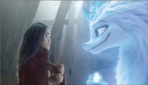  ??  ?? Raya (voiced by Kelly Marie Tran) is a young warrior princess training to become a Guardian of the Dragon Gem when she encounters Sisu (Awkwafina), a goofy young water dragon who can assume human shape in Disney’s “Raya and the Last Dragon.”