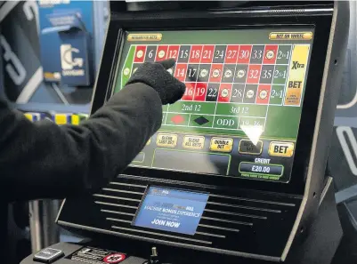  ?? Daniel Hambury ?? > The maximum amount a punter can stake on a single spin is to be cut following growing disquiet among politician­s about the harm being caused on Britain’s high streets by the FOBTs