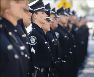  ?? PAUL BERSEBACH — STAFF PHOTOGRAPH­ER ?? Officers wait to be inspected by Santa Ana Chief of Police David Valentin and his commanders in 2018.