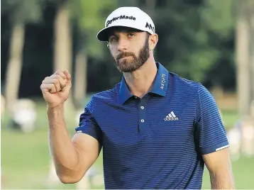  ?? — GETTY IMAGES ?? Dustin Johnson reacts after sinking his birdie putt on the first playoff hole to beat Jordan Spieth and win The Northern Trust tournament Sunday.