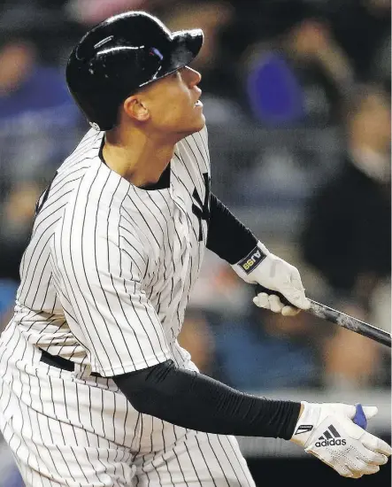  ?? ADAM HUNGER/GETTY IMAGES ?? No player typifies the all-or-nothing trend in MLB more than New York Yankees slugger Aaron Judge, who hit 52 homers in 2017 but struck out 208 times.