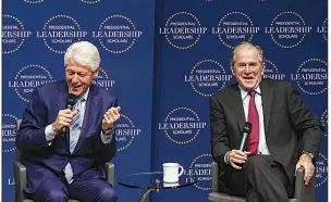  ?? Arkansas Democrat-Gazette/MITCHELL PE MASILUN ?? Former U.S. Presidents Bill Clinton and George W. Bush share a laugh during Thursday’s graduation ceremony of the 2018 Presidenti­al Leadership Scholars Program.