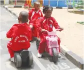  ??  ?? ECD B pupils showcase what happens at a stop sign when driving