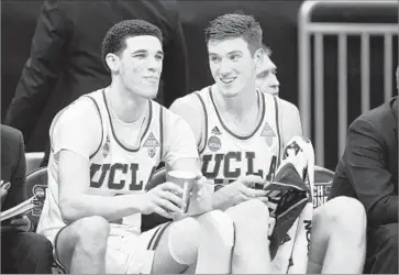  ?? Wally Skalij Los Angeles Times ?? LONZO BALL, left, and TJ Leaf declared for the NBA draft after spending only one season playing for UCLA. Ball’s brother LiAngelo, a freshman guard for the Bruins this season, is expected to follow suit.