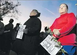  ?? Rick Loomis Los Angeles Times ?? ELISA SALOMON attends a vigil in November in honor of Gabriela Calzada and Briana Gallegos, whose bodies were found in Ernest E. Debs Regional Park.