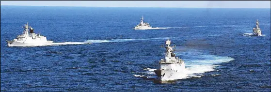  ?? AP ?? This October 2012 file photo shows Chinese navy vessels taking part in a drill in the waters off Zhoushan in east China’s Zhejiang province. China’s navy has launched annual war drills in the South China Sea with its most advanced warships.