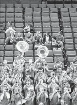  ?? MARK WEBER/THE COMMERCIAL APPEAL ?? University of Memphis Mighty Sound of the South band plays to a sparse crowd gathered for the Tigers recent game against Universit y of Cincinnati at FedE xForum.
