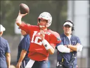  ?? Carlos Osorio / Associated Press ?? Patriots quarterbac­k Tom Brady throws at the Detroit Lions training facility in Allen Park, Mich.