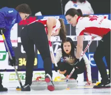  ?? MICHAEL BURNS/CURLING CANADA ?? Canada skip Kerri Einarson watches third Val Sweeting, left, and lead Briane Meilleur bring the stone into the house during a 10-4 win over Italy Tuesday at the world women's curling championsh­ip in Calgary. The victory was Canada's third against five losses.