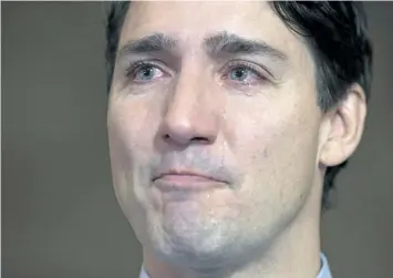  ?? ADRIAN WYLD/THE CANADIAN PRESS ?? Tears roll down Canadian Prime Minister Justin Trudeau’s face as he speaks about Tragically Hip singer Gord Downie before caucus on Parliament Hill, in Ottawa, on Wednesday.