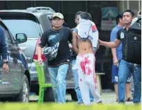  ?? Dedi Sinuhaji / EPA ?? A plaincloth­es policeman detains a suspect after the failed suicide bombing at St Yoseph Catholic Church in Medan, Indonesia yesterday, in which the parish priest was hurt.