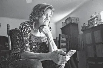  ?? Jon Shapley / Staff photograph­er ?? Elizabeth Waller listens to a song written by her youngest son, Colton White, at her home in Tyler. Colton, who wants to be a rapper one day, wrote the song about his brother, Stetson.