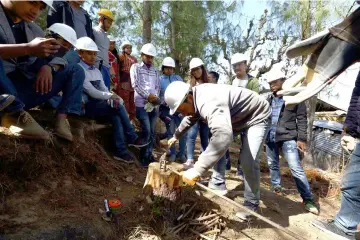  ??  ?? In this photograph taken on April 13, engineers train in retrofitti­ng techniques outside an earthquake-damaged house in the village of Dungkharka in Kavre district, some 45km east of Kathmandu. — AFP photo