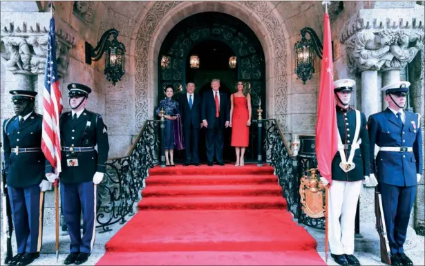  ?? LAN HONGGUANG / XINHUA ?? US President Donald Trump and first lady Melania Trump welcome President Xi Jinping and first lady Peng Liyuan to the Mar-a-Lago estate in West Palm Beach, Florida, on Thursday.
