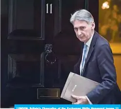  ??  ?? LONDON: Britain’s Chancellor of the Exchequer Philip Hammond leaves 11 Downing Street in London. —AFP