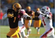  ??  ?? AP PHOTO BY RICK SCUTERI Arizona State wide receiver N’keal Harry (1) fends off Utah defensive back Jaylon Johnson in the second half of an NCAA college football game, Saturday, Nov. 3, in Tempe, Ariz.