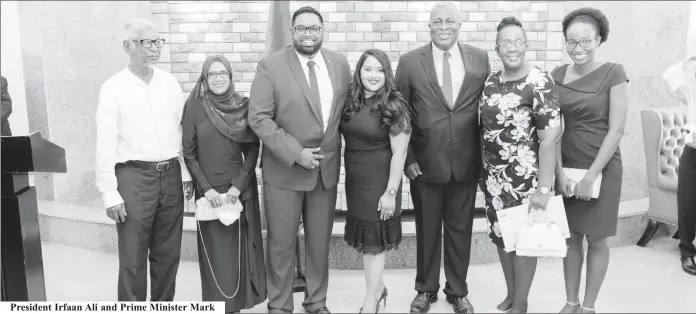  ??  ?? President Irfaan Ali and Prime Minister Mark
Phillips posing with their families