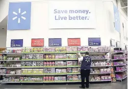  ??  ?? In this November 9, 2017 file photo, a Walmart employee scans items while conducting an exercise during a Walmart Academy class session at the store in North Bergen, New Jersey.