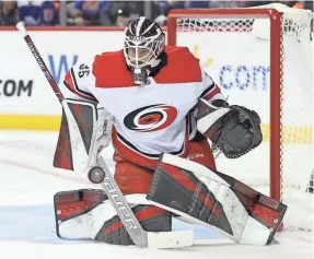  ?? BRAD PENNER/USA TODAY SPORTS ?? Hurricanes backup goalie Curtis McElhinney makes a save against the Islanders during their playoff game Sunday.