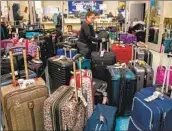  ?? Irfan Khan Los Angeles Times ?? A MASS of luggage at LAX after Southwest canceled thousands of f lights during a December meltdown.